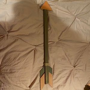 Pink wooden wall hanging arrow